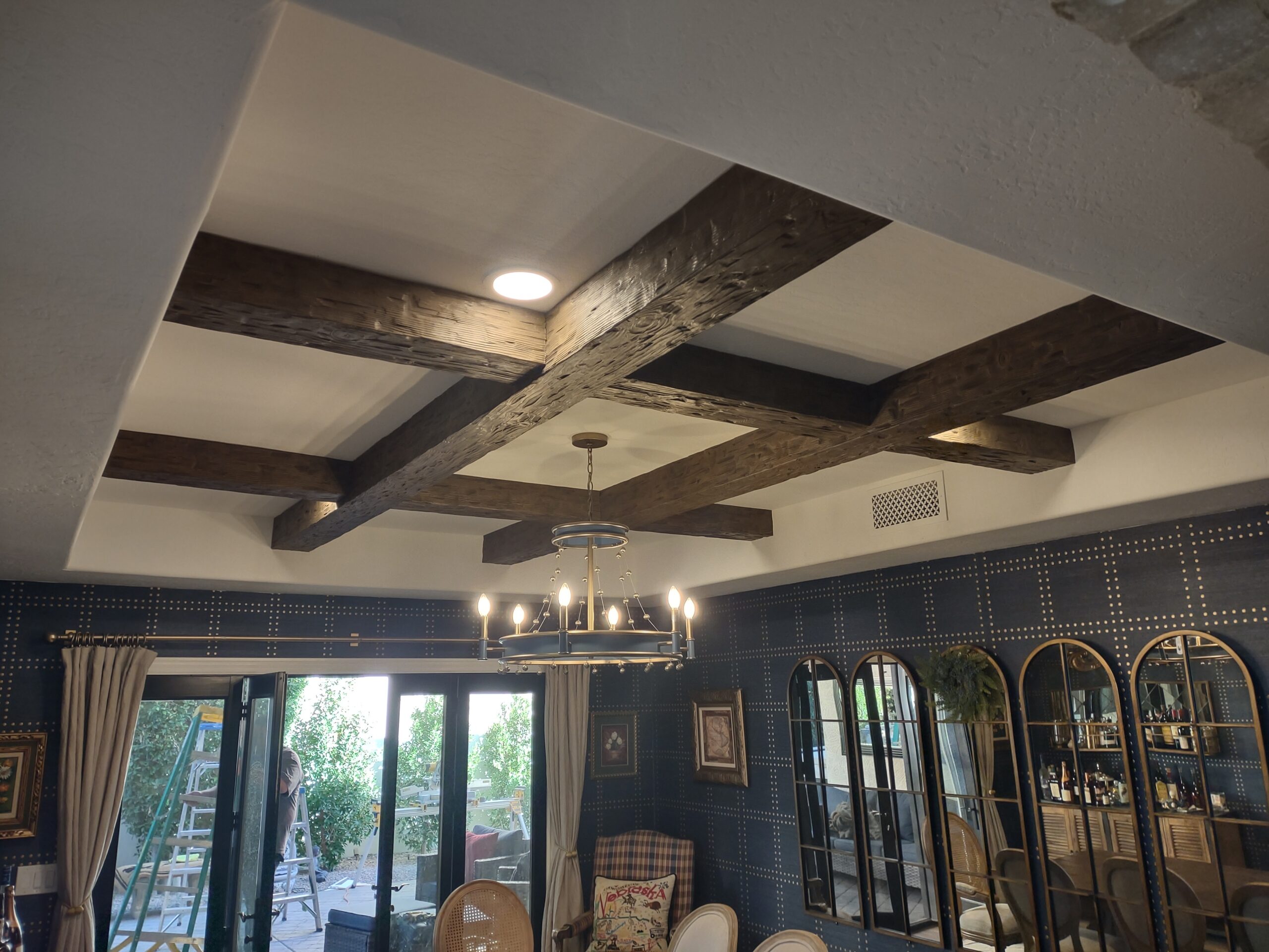 Custom decorative ceiling beam installation in Scottsdale AZ by Heritage Crown and Millworks