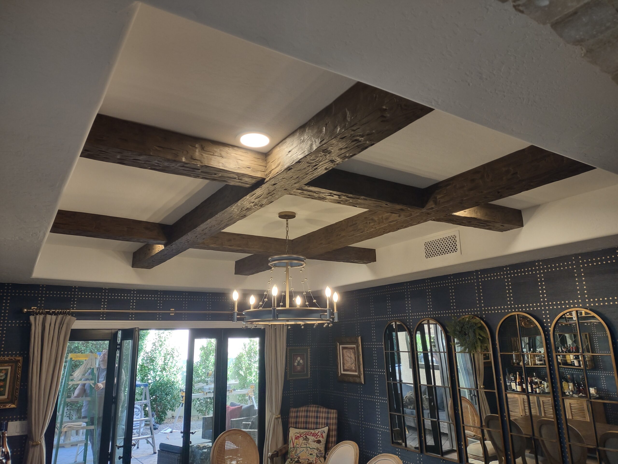 Custom decorative ceiling beam installation in Scottsdale AZ by Heritage Crown and Millworks