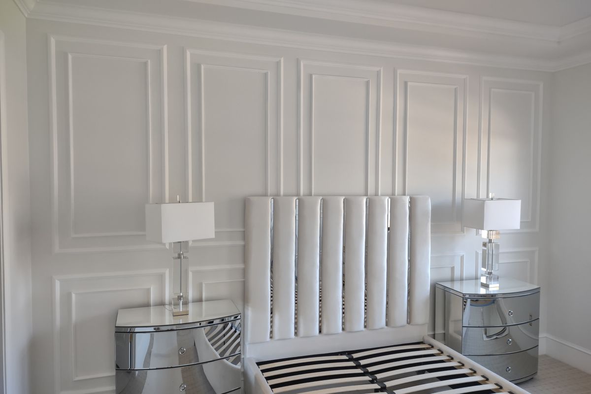 Custom picture frame moulding in bedroom by Heritage Crown and Millworks