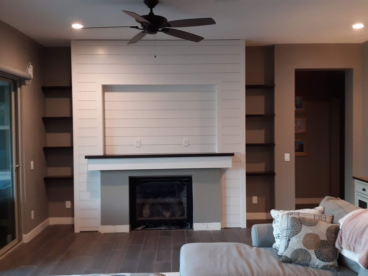 Custom horizontal shiplap fireplace wall by Heritage Crown and Millworks