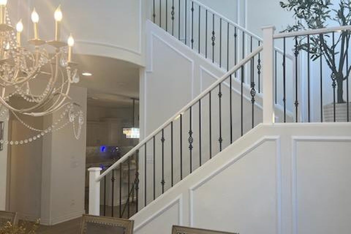 Custom staircase wainscoting and millwork by Heritage Crown and Millworks