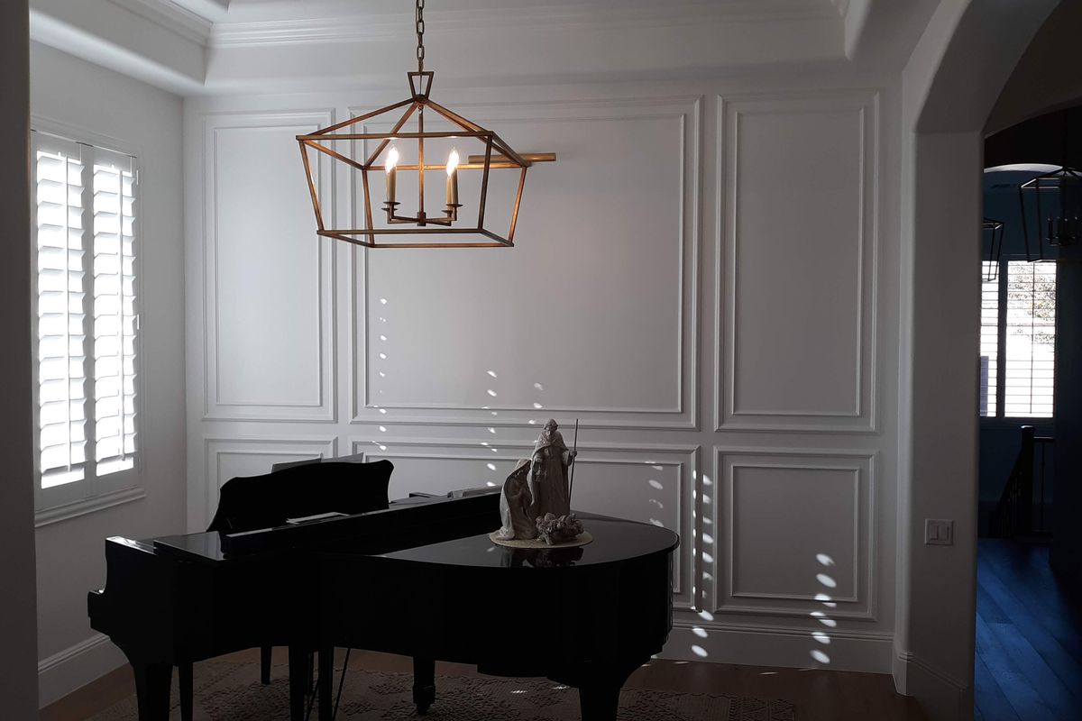 Custom wainscoting and millwork in dining room by Heritage Crown and Millworks. Heritage Crown and Millworks custom craftsmanship